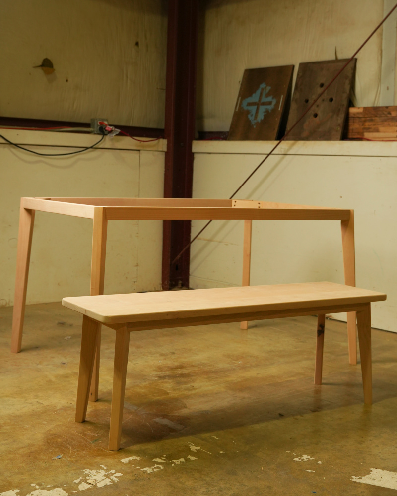 Unfinished custom table base and matching bench before finishing