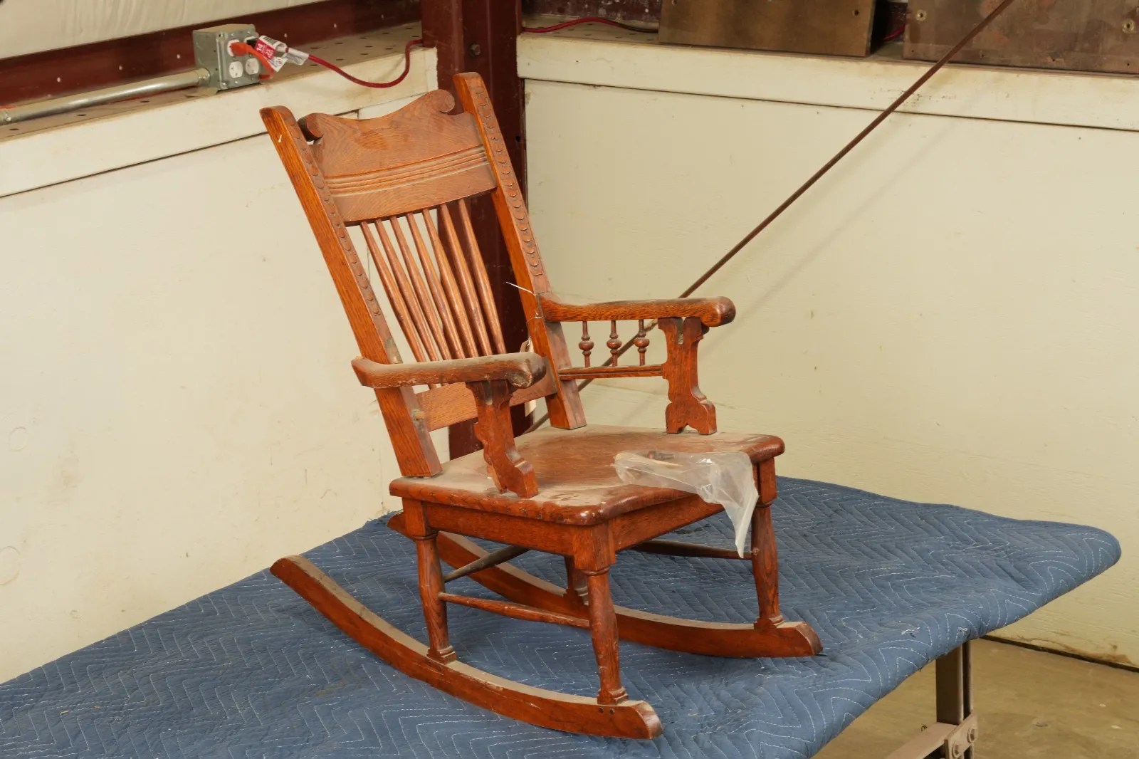 Antique rocking chair before structural furniture repair