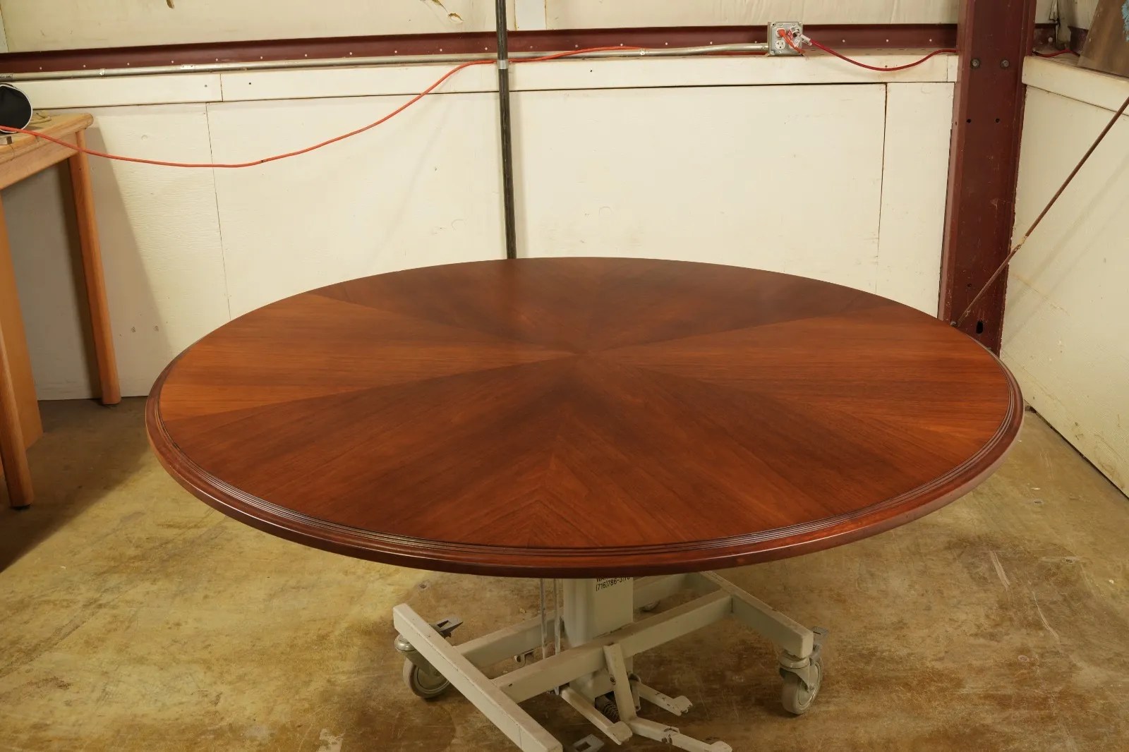 Round mahogany dining table restored by G. Michael's in Fort Collins