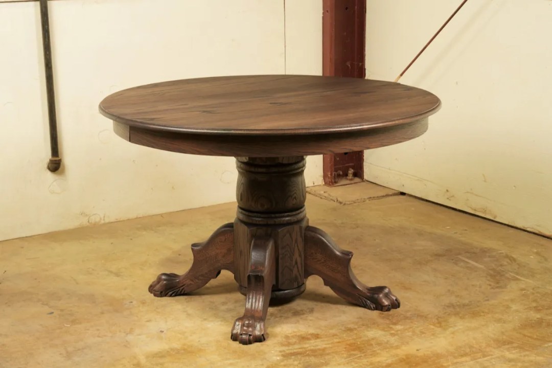 Restored round oak table with carved pedestal base